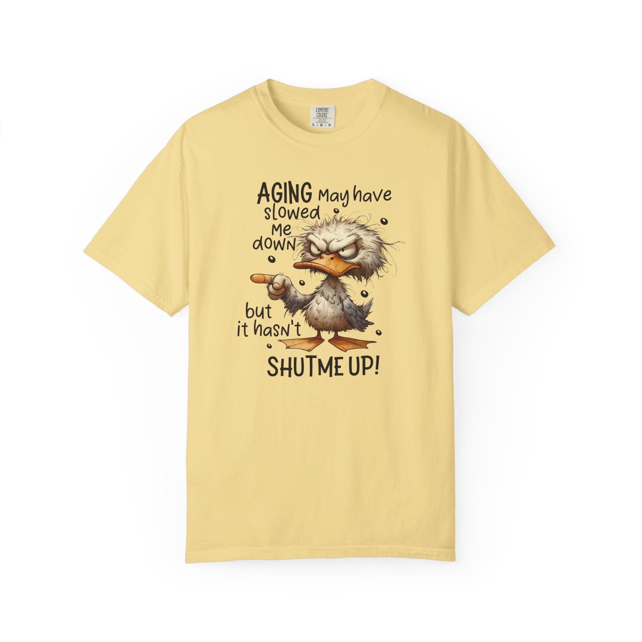 A light yellow heavyweight cotton t-shirt featuring a grumpy duck illustration and humorous text.