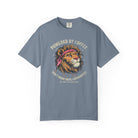 Blue t-shirt featuring a graphic of a lion wearing a bandana with the text Powered by Coffee.
