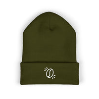 An olive green cuffed knit beanie featuring a small white embroidered coffee bean icon.