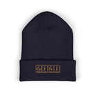 A navy blue cuffed beanie with "COFFEE" embroidered in periodic table style.