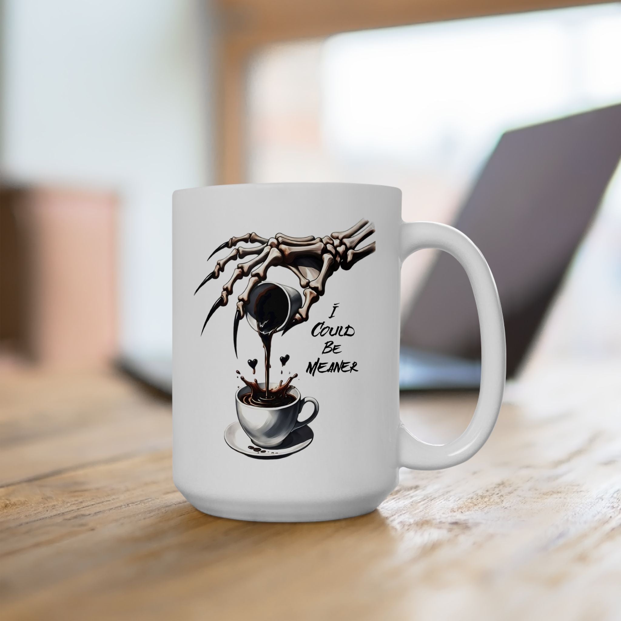 A white mug with a skeleton hand pouring coffee and the text "I Could Be Meaner".