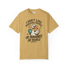 Mustard yellow t-shirt featuring a grumpy duck holding a coffee mug with text about morning people.