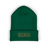 A green cuffed beanie with "COFFEE" embroidered in periodic table style.