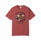 Red t-shirt featuring a graphic of a cowboy rooster pouring coffee with the text Rise & Shine.