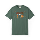 Green t-shirt featuring a stick figure with a coffee mug and a dog with the text Coffee and Dogs.