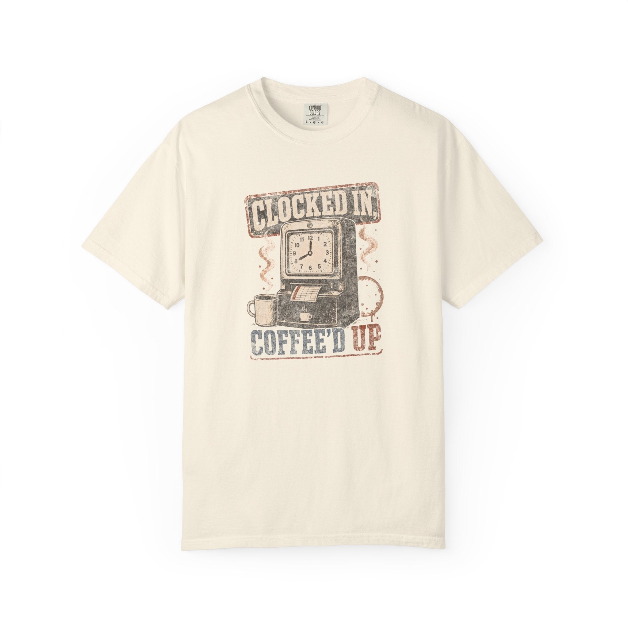 Cream-colored Comfort Colors 1717 t-shirt with a vintage Clocked In Coffee'd Up graphic design.