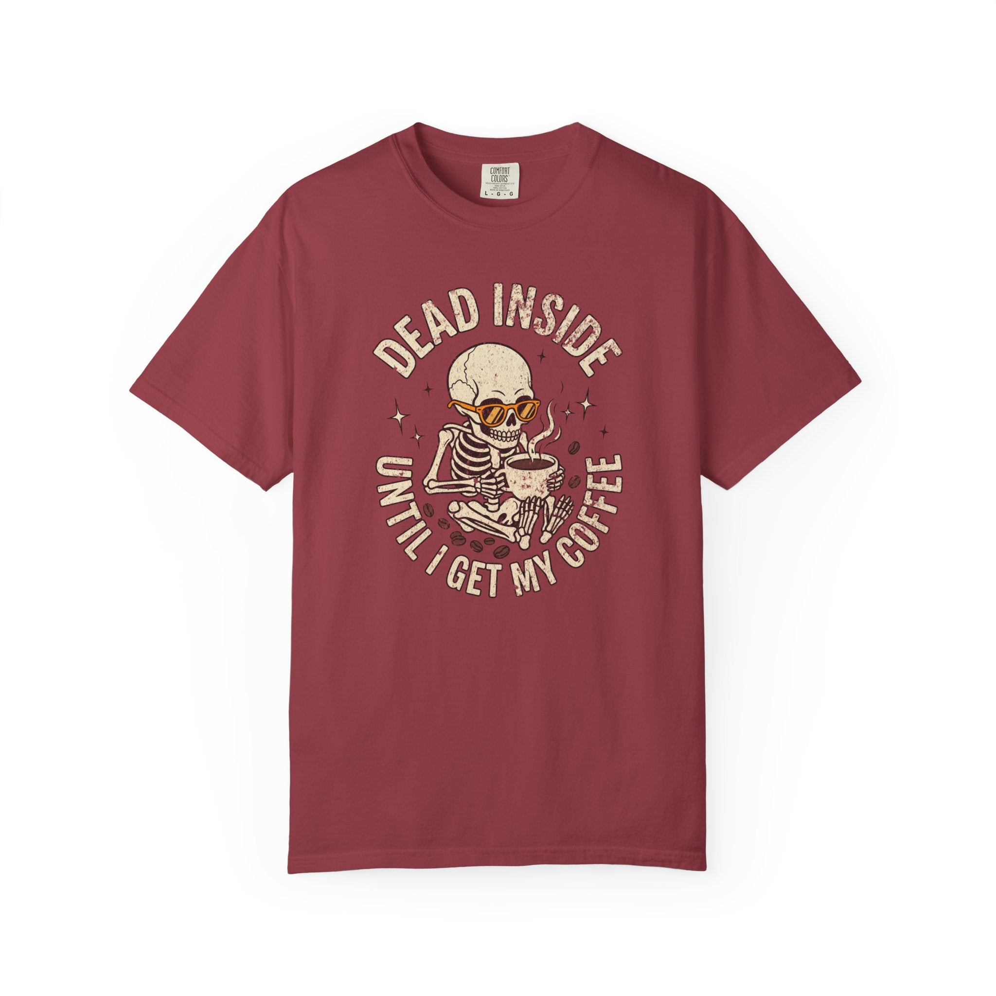 Maroon t-shirt featuring a skeleton wearing sunglasses and holding a steaming cup of coffee.