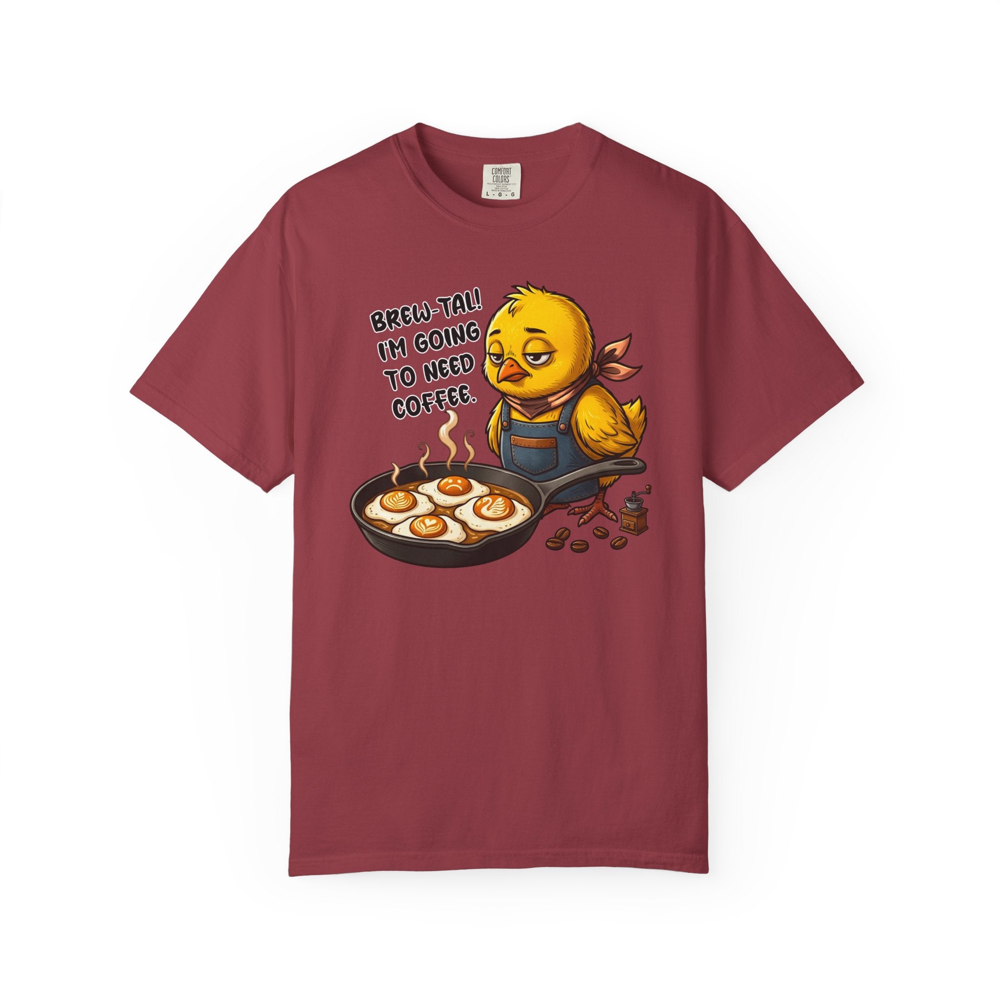 A maroon t-shirt featuring a sleepy chick in an apron with the text Brew-tal! I'm going to need coffee.