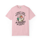 Light pink t-shirt featuring a grumpy duck wearing sunglasses and holding a coffee mug.