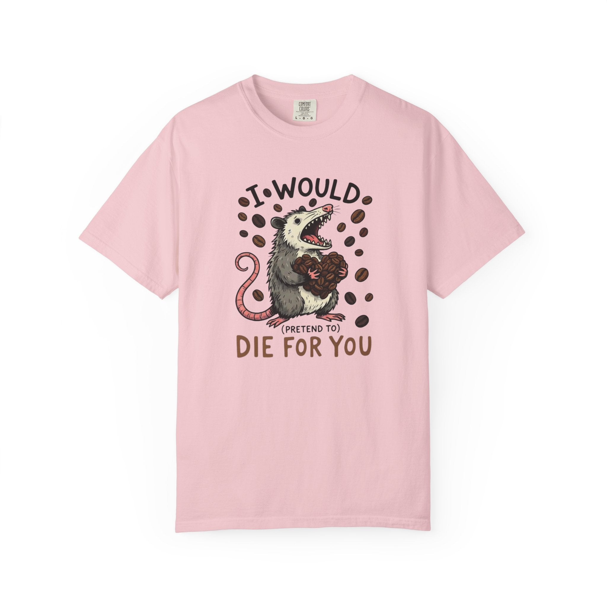 A light pink cotton t-shirt featuring a graphic of an opossum holding a heart made of coffee beans.