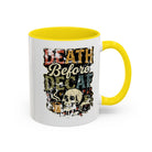 White ceramic mug with a yellow handle and a retro skull graphic reading Death Before Decaf.