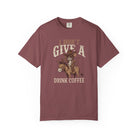 Maroon t-shirt with a graphic of a cowboy rat riding a donkey and holding a coffee cup.