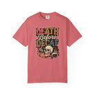 A pink unisex cotton t-shirt featuring a distressed graphic of a skull, coffee, and text.