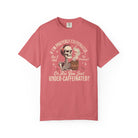 A coral-colored t-shirt featuring a graphic of a skeleton holding a steaming mug of coffee.