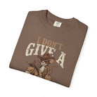 Brown t-shirt featuring a graphic of a mouse in a cowboy hat riding a donkey with text.