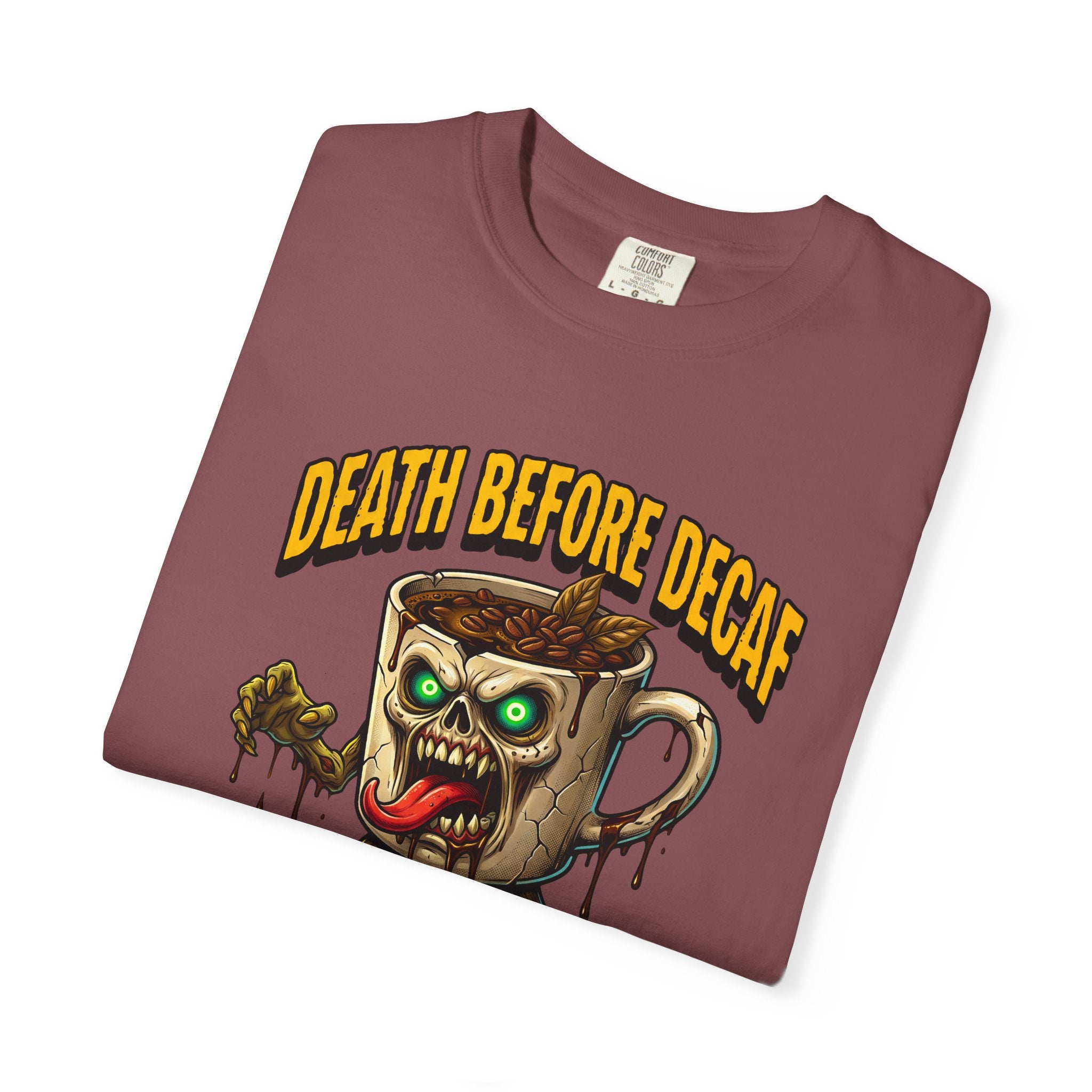 A maroon unisex t-shirt featuring a graphic of a zombie coffee mug with the text Death Before Decaf.