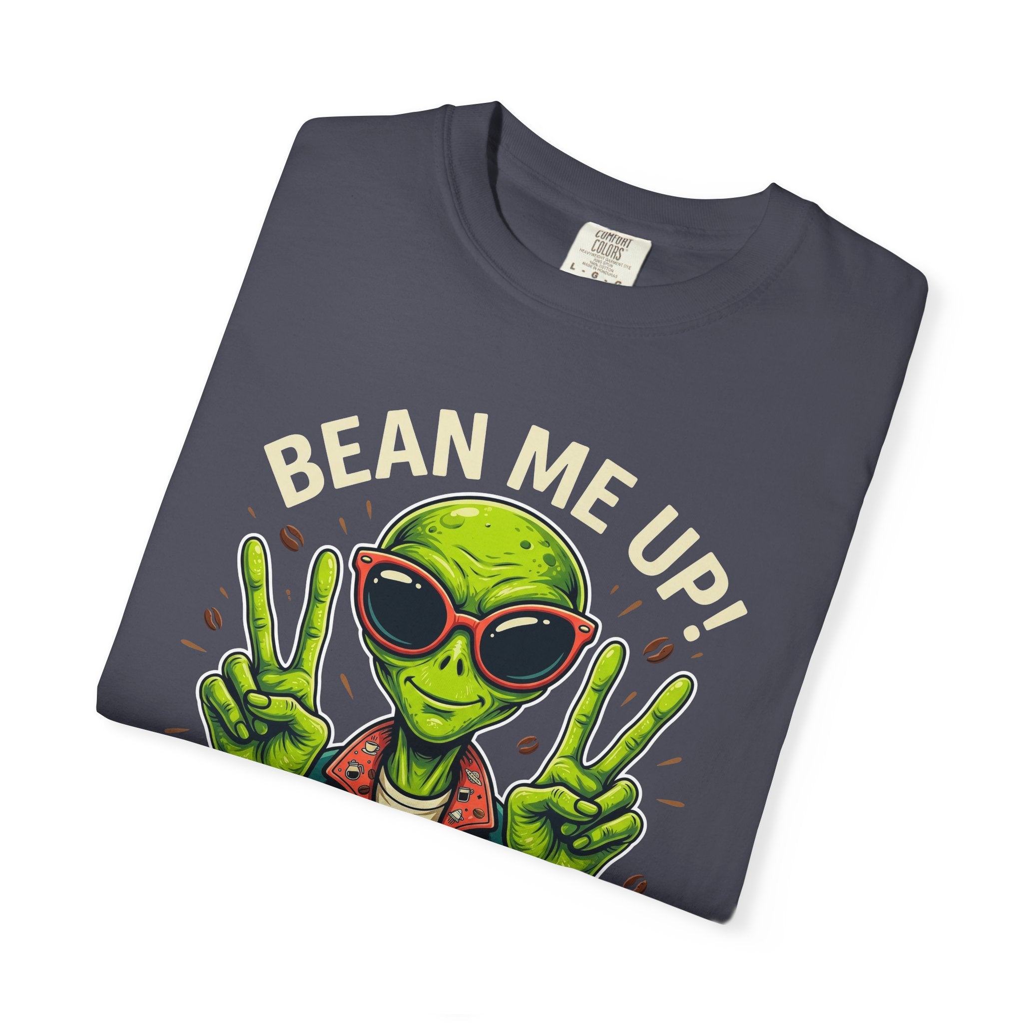 Dark grey t-shirt featuring a green alien wearing sunglasses and making peace signs with coffee.