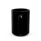 A black ceramic coffee mug with a retro pin-up design and text on the side.