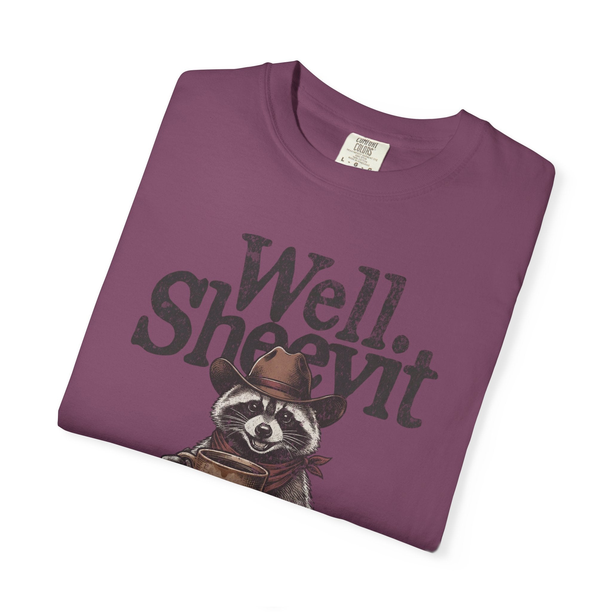 Purple t-shirt featuring a raccoon wearing a cowboy hat and holding a coffee mug.
