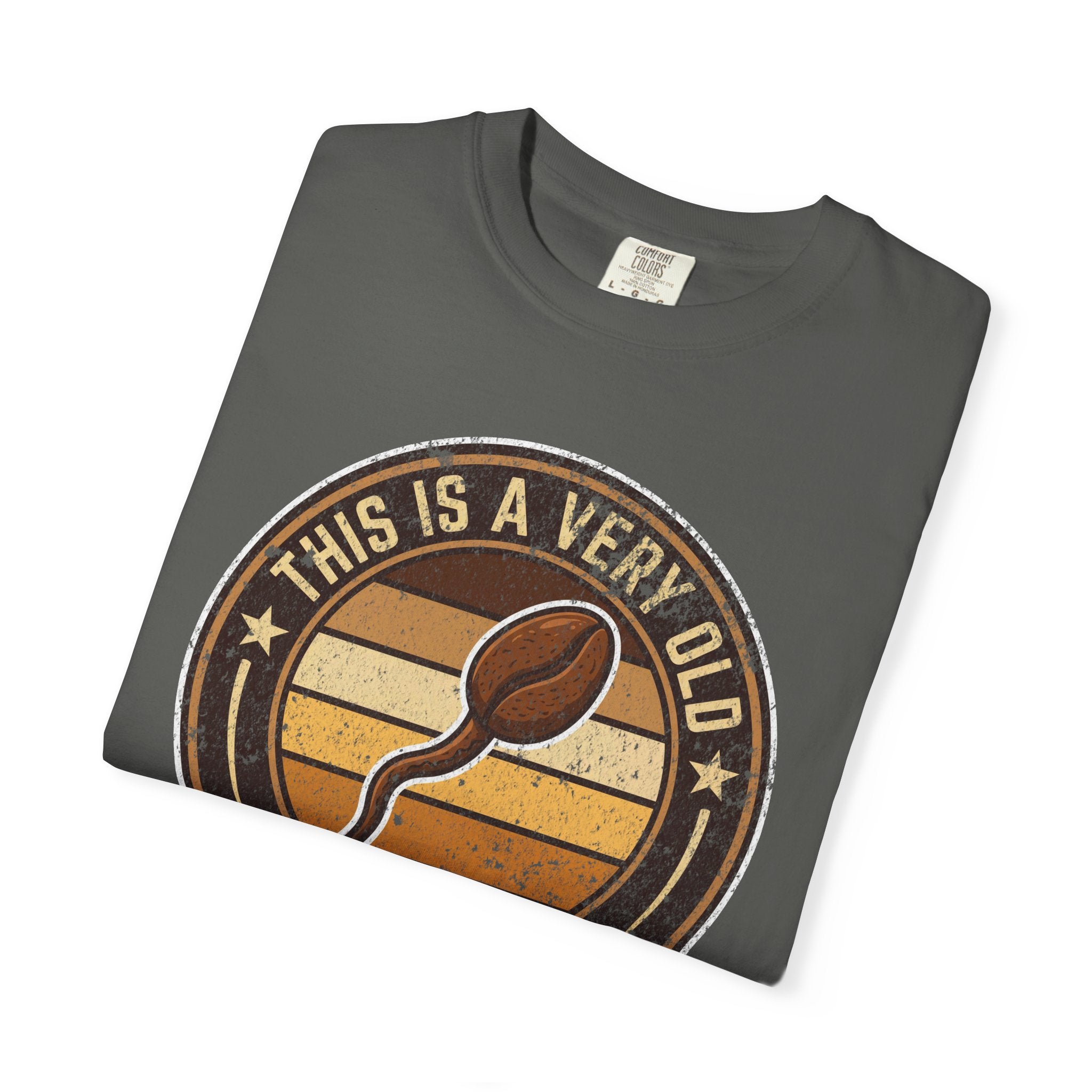 A charcoal gray t-shirt featuring a vintage-style graphic of a coffee bean and retro text.